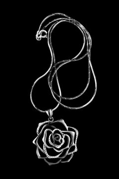 Silver necklace on black