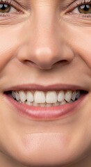 Fototapeta premium Close-up of a smiling caucasian female with healthy teeth and smooth skin