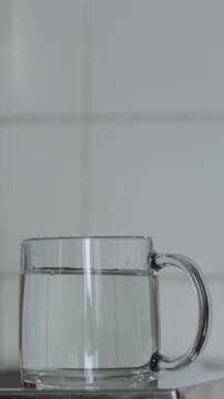 Daily routine ritual. Before water quality analysis, determination of overall hardness or softness. Vertical shot