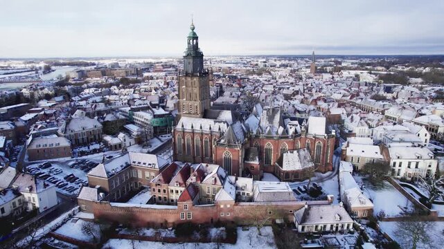 Historic heritage buildings surrounding cityscape of Walburgiskerk church winter wonderland after snowstorm