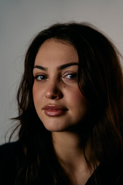 Portrait Of A Woman With Dark Hair And Soft Natural Lighting, Contemplative Expression