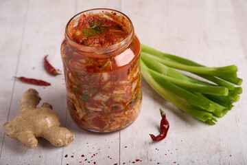 Traditional Korean Kimchi in Glass Jar with Ingredients