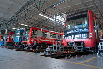 Subway several trains in a depot above a repair pit, industrial view © aapsky