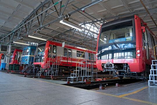 Subway several trains in a depot above a repair pit, industrial view