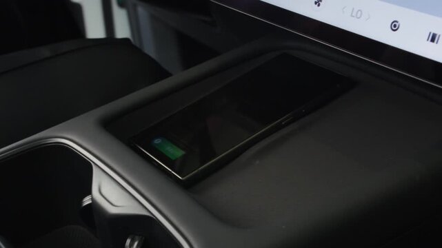 Modern Hybrid Car Interior with Smart Keyless Entry, Touchscreen Display and Wireless Smartphone Charging