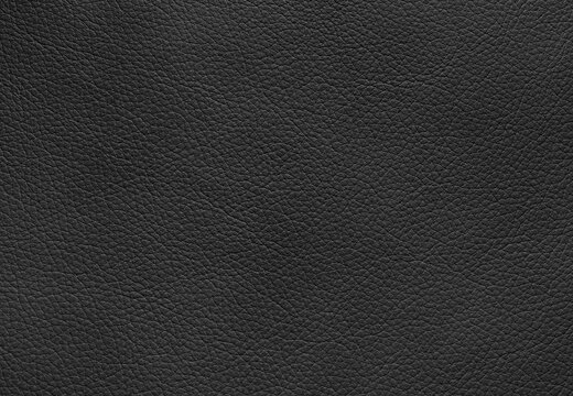 Genuine black natural leather texture background.