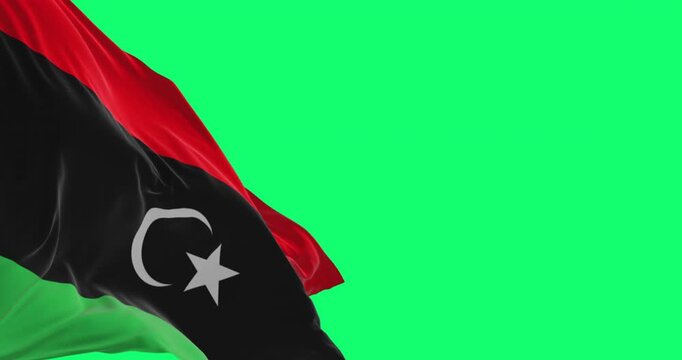 National flag of Libya waving isolated on green background