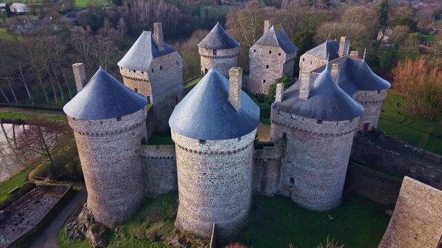 Historic medieval fortified castle with its eight round towers in Lassay-les-Ch&acirc;teaux, Mayenne, France. Aerial drone sideways