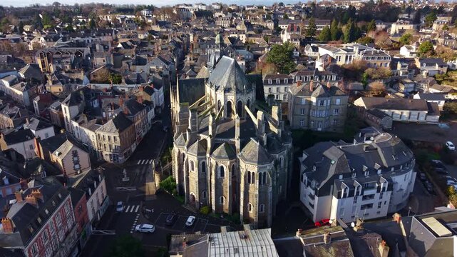 Historic gothic architecture of Basilica of Notre Dame of Miracles in town of Mayenne, France. Aerial drone view