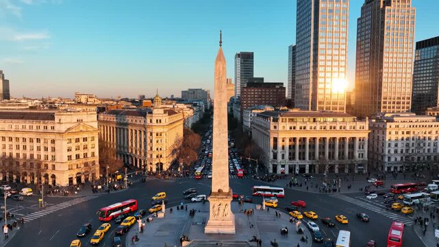 City square with obelisk and traffic