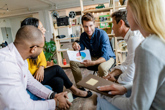 Businessman leading a presentation in loft office
