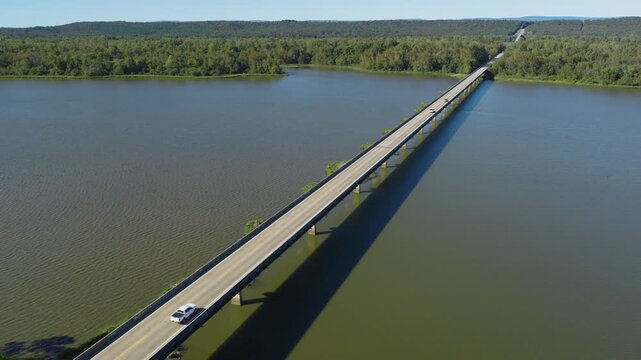 Cars Driving Through Morrison Bluff Bridge Over Arkansas River In Scranton, Arkansas, USA. - aerial shot