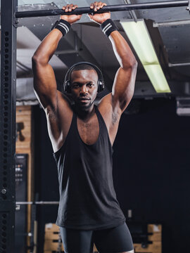 Athlete standing in gym, preparing for training