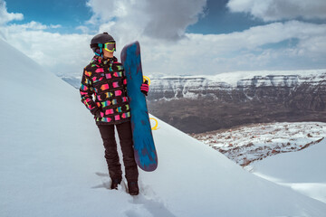 Female Snowboarder Enjoying Winter Vacation