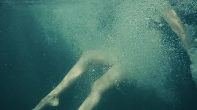 Swimmer Legs Moving Underwater In Blue Ocean. Freedom Of Movement