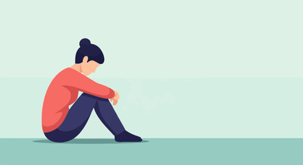 Obraz premium Solitary figure, head bowed, sits alone on the floor, lost in thought