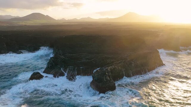 Los Hervideros is a dramatic stretch of volcanic coastline in Yaiza, Lanzarote, where the Atlantic Ocean crashes into sea caves and basaltic cliffs. Formed during the Timanfaya eruptions between 1730 