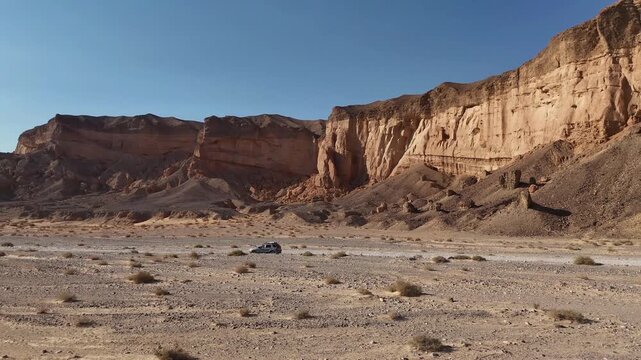 Aerial View Of Family Car Driving Desert Paran

Drone footage captured on February 12 2026 showing vehicle crossing vast Paran desert landscape Israel
