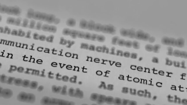 Close-up of text on paper showing the words "communication nerve center" in focus