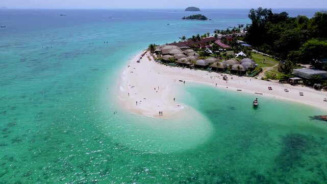 Experience the beauty of Koh Lipe, Thailand, where golden sands meet turquoise waters. This picturesque location invites travelers to relax, explore, and enjoy the vibrant marine life.