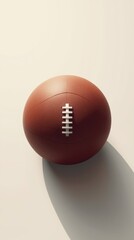 A close-up view of a brown football with a white lace pattern on a light background