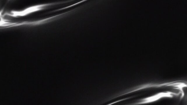 Abstract black and white liquid silk wave movement with smooth metallic reflection and fluid flowing animation for elegant background