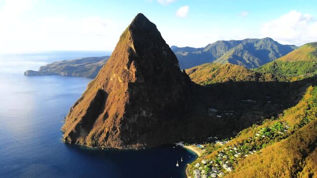 Experience the stunning landscape of St Lucia featuring the iconic Pitons rising majestically from the turquoise waters. This tropical paradise invites relaxation and adventure in nature's splendor.