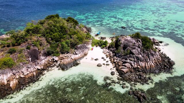 Experience the breathtaking beauty of Koh Lipe, Thailand, where turquoise waters meet white sandy beaches.