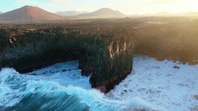Los Hervideros is a dramatic stretch of volcanic coastline in Yaiza, Lanzarote, where the Atlantic Ocean crashes into sea caves and basaltic cliffs. Formed during the Timanfaya eruptions between 1730 