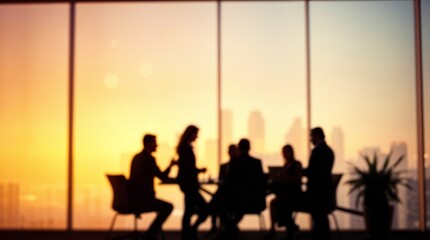 Blurred silhouette of a business team having a meeting in a modern office with a city skyline
