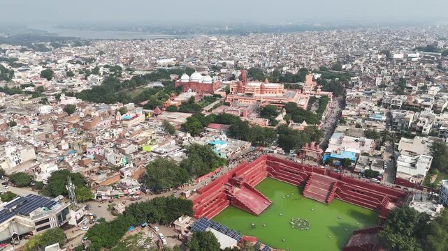 Aerial view of Shri Krishna Janm Bhumi and Potra Kund&rsquo;s red sandstone ghats, surrounded by Mathura&rsquo;s dense sacred cityscape and temple complexes.