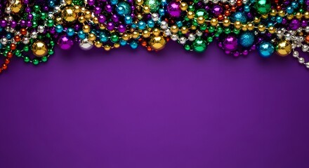 Vibrant mardi gras beads and ornaments on purple background for festive celebrations and parties