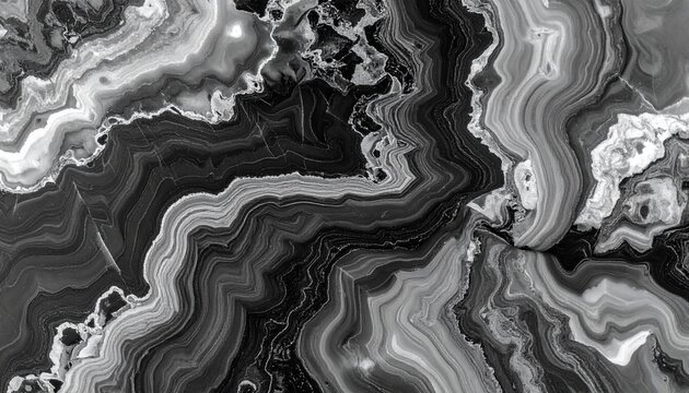 Monochromatic Marble Abstract: A striking abstract pattern created by the swirling veins and layers of black and white marble, showcasing organic curves and textures.