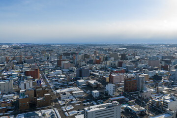Fototapeta premium Winter Cityscape of Obihiro, Hokkaido, Japan under Cloudy Sky