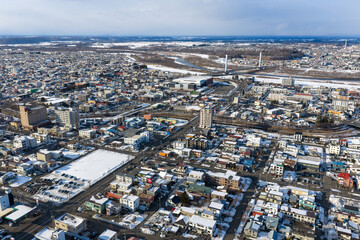 Fototapeta premium Winter Cityscape of Obihiro, Hokkaido, Japan under Cloudy Sky