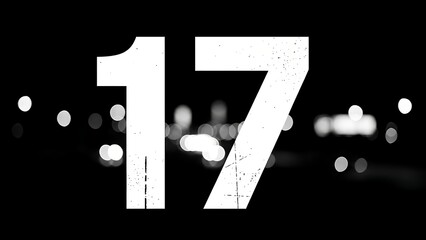 Large white number seventeen on black background