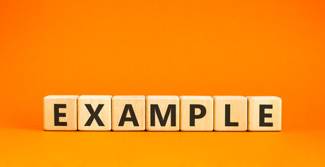 Example examples symbol. Concept word Example on beautiful wooden blocks. Beautiful orange...