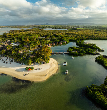 Aerial view of the serene beachside resort meets the tranquil waters, a picturesque scene of relaxation and natural beauty, Prince Maurice, Flacq District, Mauritius.