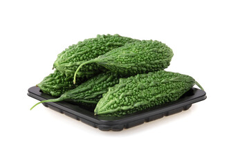 Fresh bitter gourd Bitter cucumber or bitter melon with cut slice isolated on a white background.