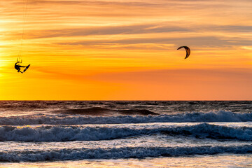 Lonely Kitesurfer against sunset background with kite in Tarifa, Spain, Andalusia. © Tomasz
