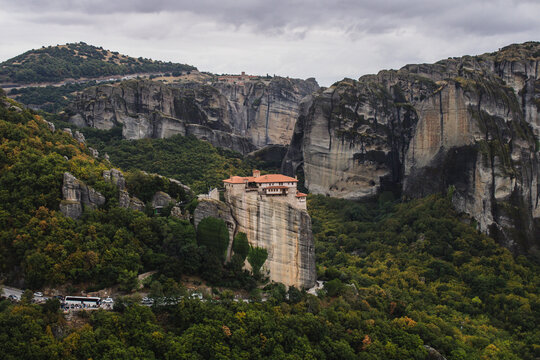 Majestic Meteora monasteries on giant sandstone rocks at sunset - Greece