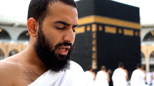 Muslim Pilgrim Praying Near the Kaaba at Masjid al-Haram in Mecca During Umrah