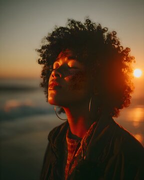 Contemplative Woman at Sunset by the Sea