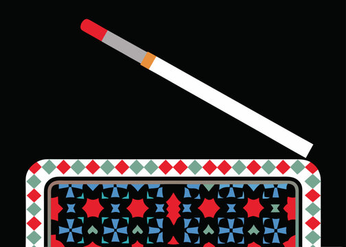 A lit cigarette resting on an ornate box with a geometric pattern against a black background