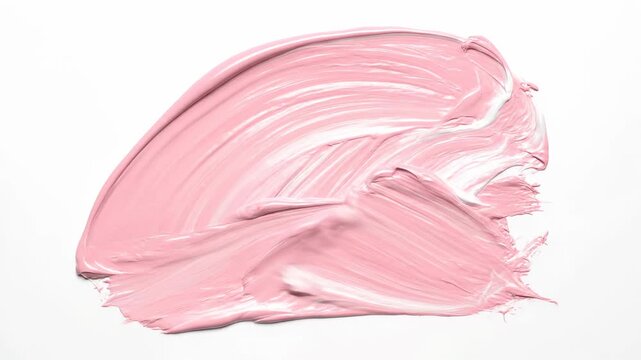 Close-up of a palette knife mixing pink and white acrylic paint on a white surface, creating soft textures and abstract strokes, macro view.