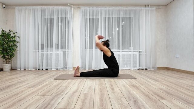 White Man Performing Yoga Seated Forward Fold On Wooden Floor With Sheer Curtains And Plant, Deep Hamstring Stretch, Breathfocused Relaxation, Slow Cooldown For Flexibility And Posture.