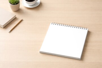 Blank Spiral Notebook on Minimalist Wood Desk with Coffee and Plant
