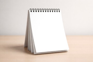 Blank Spiral Desk Calendar Mockup on Wooden Table