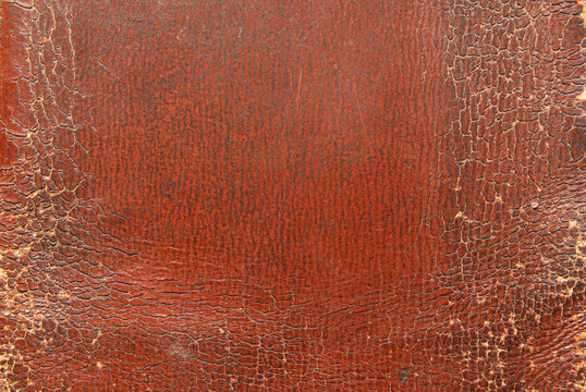 Cracked brown leather texture as background