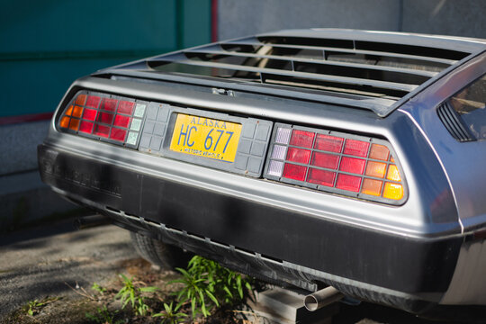 The taillights and license plate of a DMC DeLorean sports car. Anchorage, Alaska &ndash; May 2022